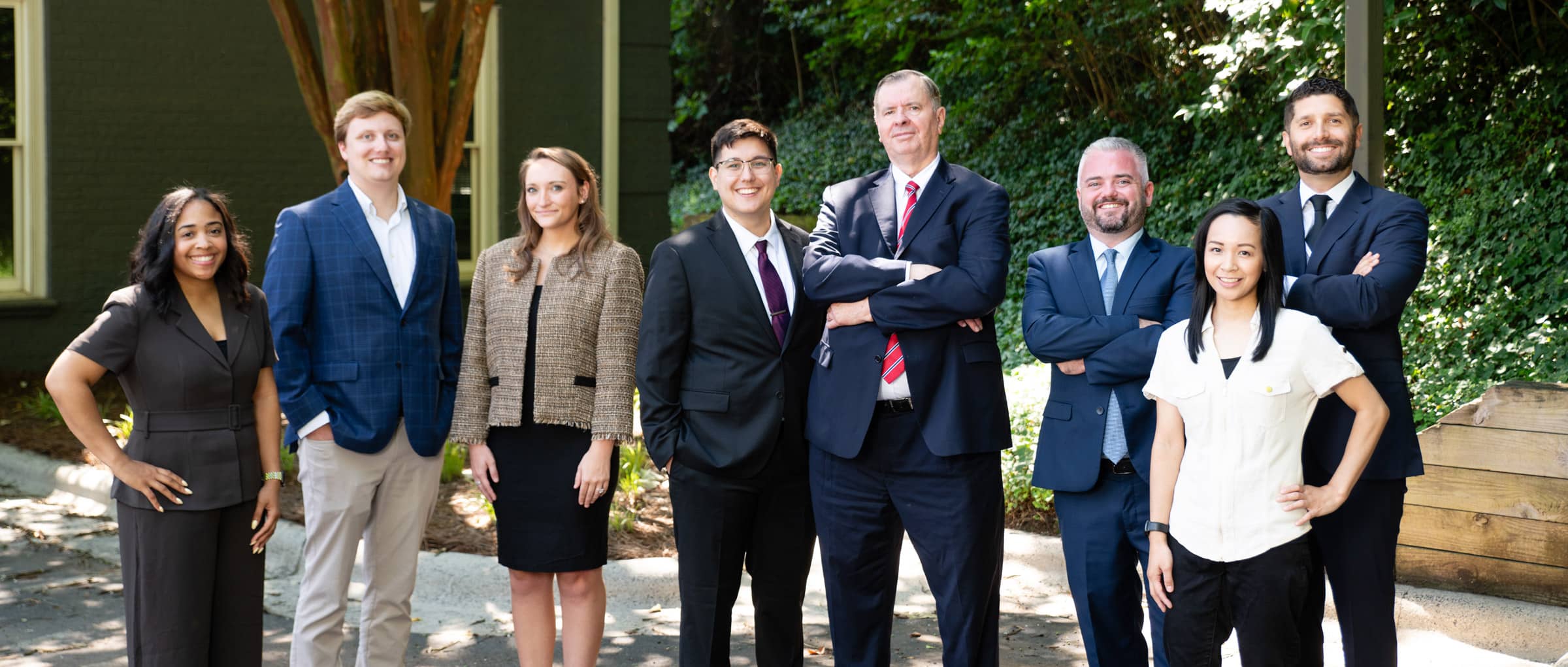 Grabowski & Lipack Team posed together outdoors